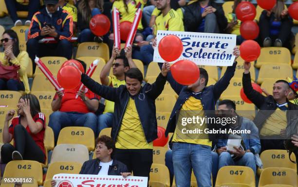 Fans of Colombia cheer for their team during a training session open to the public as part of the preparation for FIFA World Cup Russia 2018 on May...