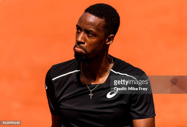 Gael Monfils of France shows his frustration to his box against Elliot Benchetrit of France in the first round of the French Open at Roland Garros on...