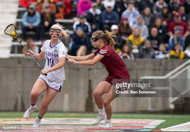 Katie Kerrigan of the James Madison Dukes is defended by Carly Bell of the Boston College Eagles during the Division I Women's Lacrosse Championship...