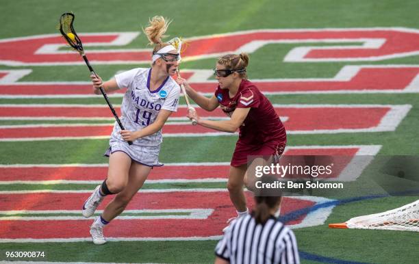 Katie Kerrigan of the James Madison Dukes is defended by Carly Bell of the Boston College Eagles during the Division I Women's Lacrosse Championship...