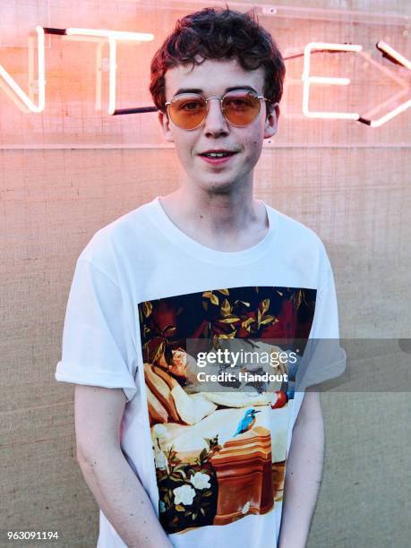 In this handout image supplied by Ray-Ban, Alex Lawther wearing Ray-Ban poses at the Ray-Ban Studios during All Points East Festival at Victoria Park...