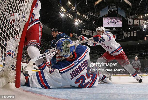 Goaltender Chad Johnson of the New York Rangers makes a save against the Colorado Avalanche at the Pepsi Center on January 31, 2010 in Denver,...