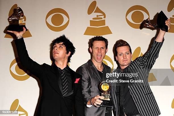 Musicians Billie Joe Armstrong, Mike Dirnt and Tre Cool of Green Day pose in the press room at the 52nd Annual GRAMMY Awards held at Staples Center...