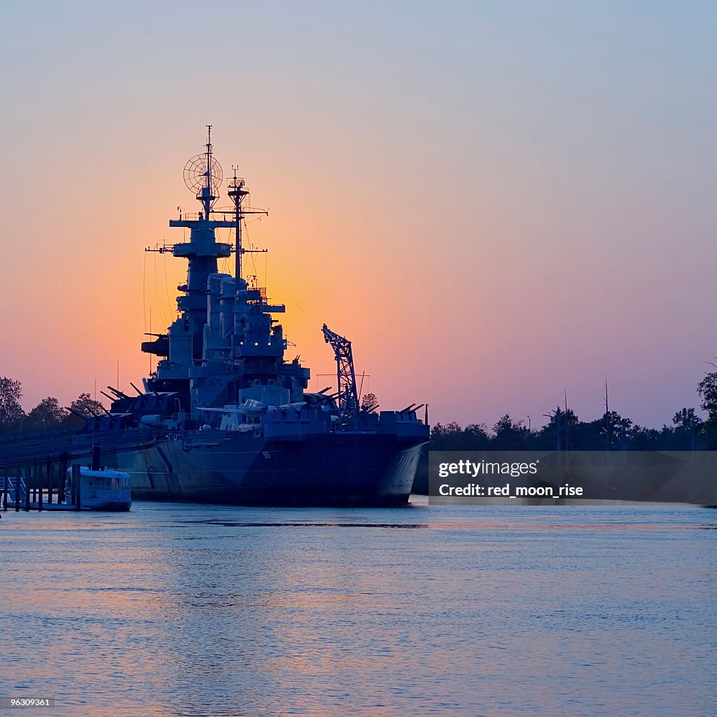 Sunset behind USS North Carolina