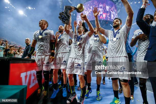 Michael Guigou of Montpellier Handball and the MHB team are showing the trophy of the EHF Final 4 to the MHB fans after the EHF Champions League...