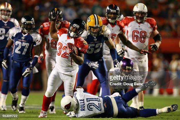 Antrel Rolle of the Arizona Cardinals tries to tackle Maurice Jones-Drew of the Jacksonville Jaguars during the 2010 AFC-NFC Pro Bowl at Sun Life...