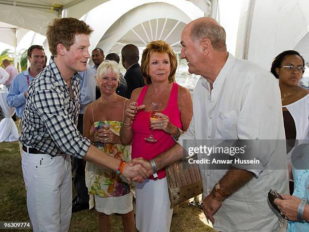 Prince Harry meets Cilla Black and Russ Abbot at a reception before the inaugural Sentebale Polo Cup on January 31, 2010 in Apes Hill, Barbados. The...