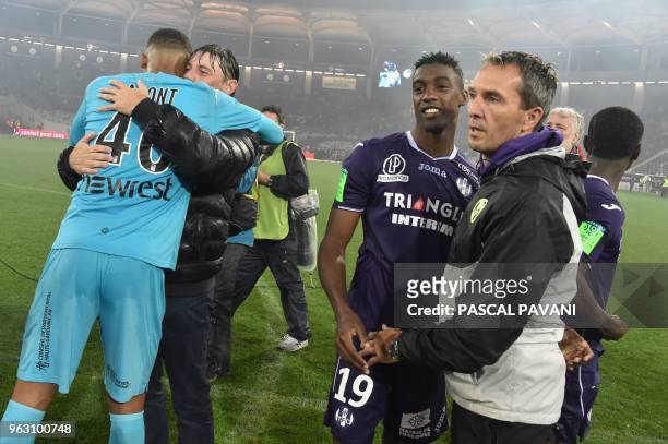 Toulouse's French goalkeeper Alban Lafont, Toulouse's French head coach Michael Debeve, Toulouse's French forward Yaya Sanogo and Toulouse's French...