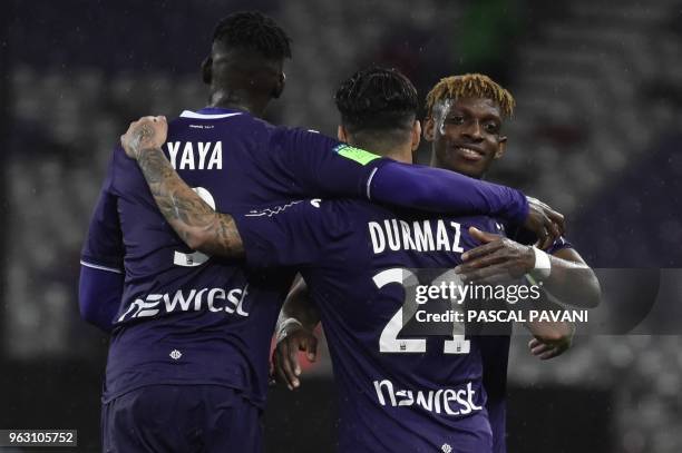 Toulouse's Brazilian midfielder Somalia, Toulouse's Swedish midfielder Jimmy Durmaz and Toulouse's French forward Yaya Sanogo celebrate their 1-0...