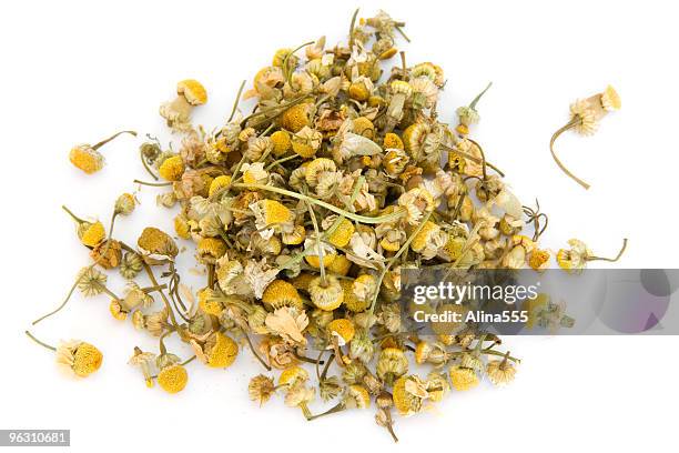 pile of chamomile on white - dry leaf stock pictures, royalty-free photos & images