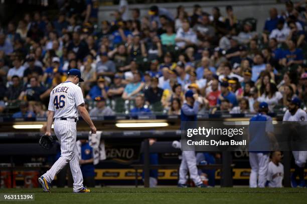 Corey Knebel of the Milwaukee Brewers walks off the field after being relieved in the ninth inning against the New York Mets at Miller Park on May...