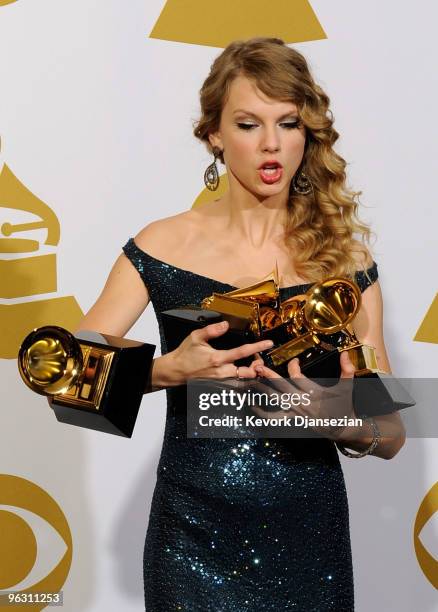 Singer Taylor Swift poses with Album Of The Year award for 'Fearless', Best Female Country Vocal Performance for 'White Horse', Best Country Song for...