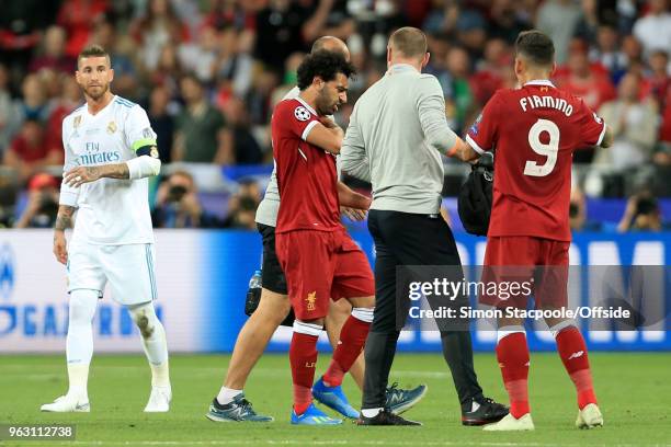 Sergio Ramos of Real looks on as Mohamed Salah of Liverpool leaves the pitch with a shoulder injury during the UEFA Champions League Final match...