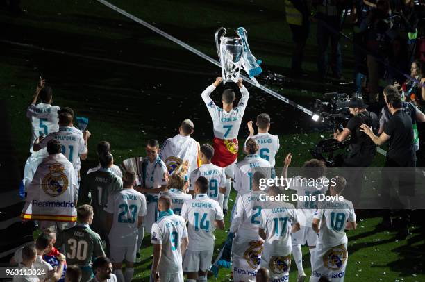 Cristiano Ronaldo of Real Madrid celebrates with teammates during celebrations at the Santiago Bernabeu stadium following their victory last night in...