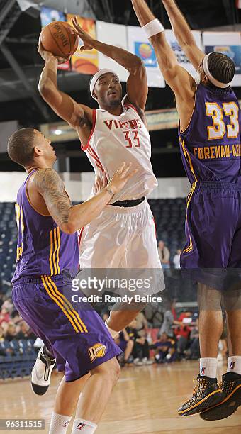 Michael Harris of the Rio Grande Valley Vipers puts up a shot over Diamon Simpson and Ryan Forehan-Kelly of the Los Angeles D-Fenders during the NBA...