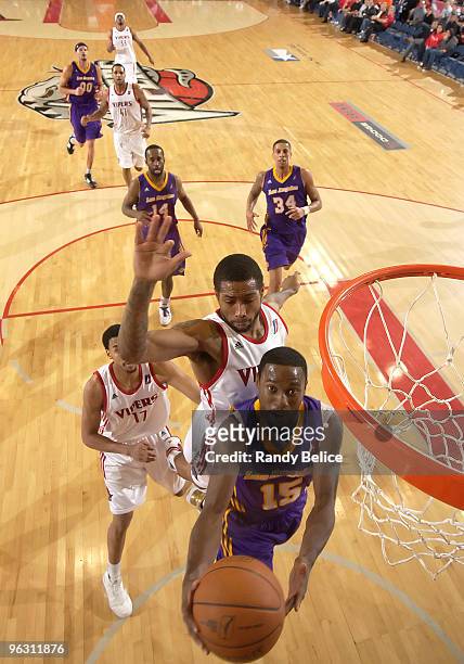 Horace Wormely of the Los Angeles D-Fenders goes to the basket Julian Sensley and Garrett Temple of the Rio Grande Valley Vipers during the NBA...