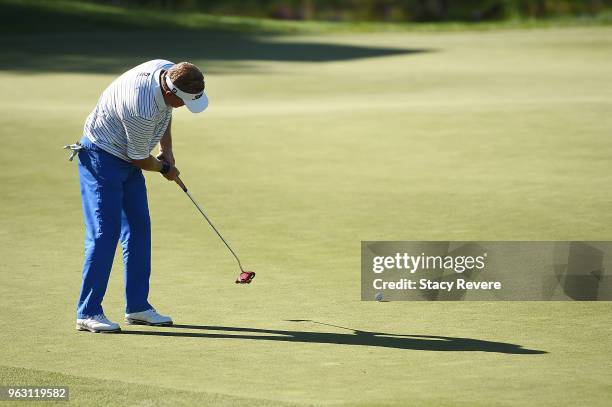 Paul Broadhurst of England putts for birdie on the 18th green during the final round of the Senior PGA Championship presented by KitchenAid at the...