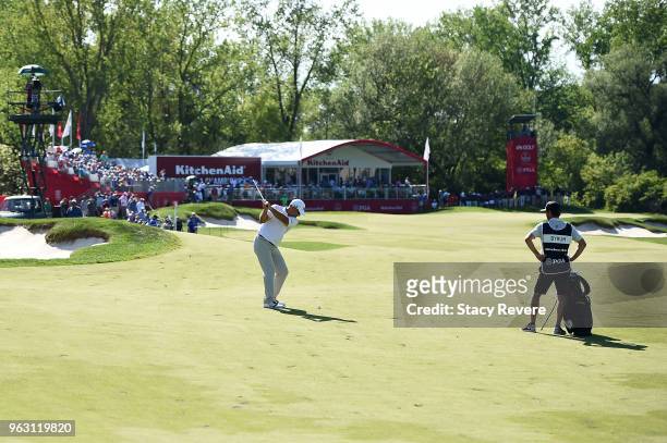 Tom Byrum hits his approach shot on the 18th hole during the final round of the Senior PGA Championship presented by KitchenAid at the Golf Club at...