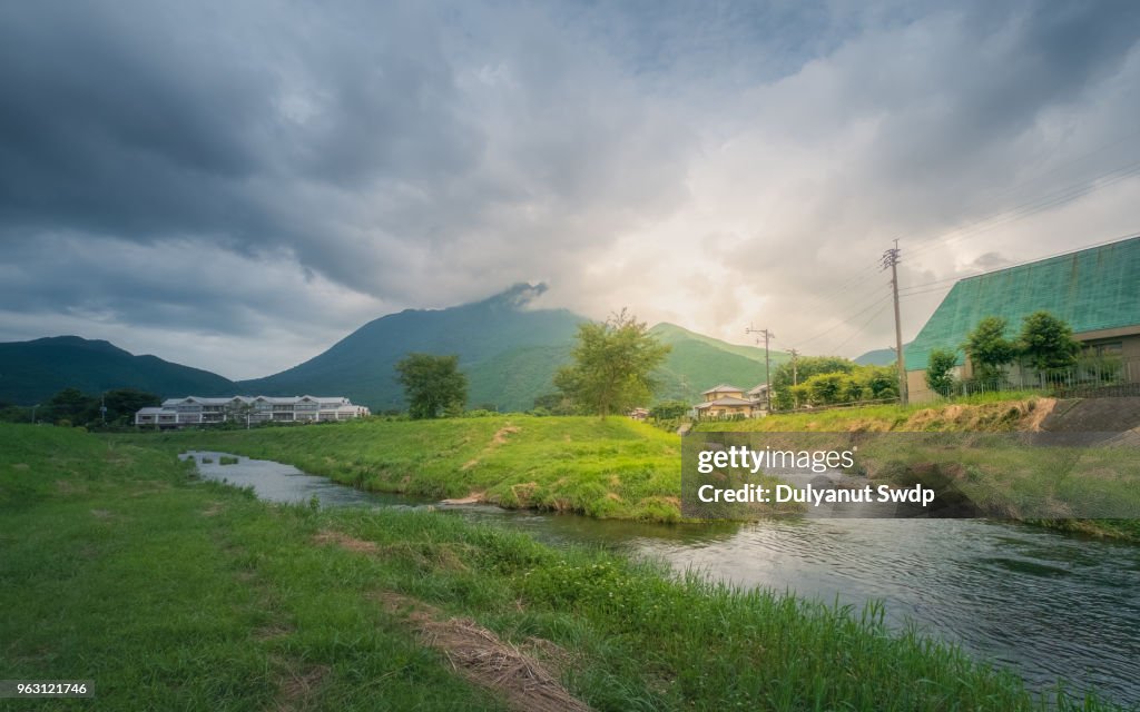 Small village with mountain and river.