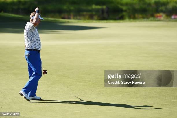 Paul Broadhurst of England reacts to a birdie putt on the 18th green to win the Senior PGA Championship presented by KitchenAid at the Golf Club at...
