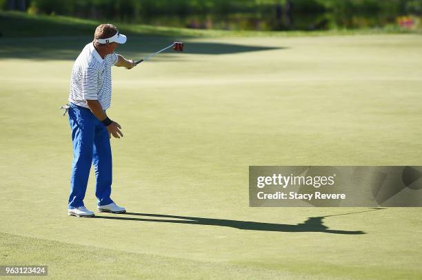 Paul Broadhurst of England reacts to a birdie putt on the 18th green to win the Senior PGA Championship presented by KitchenAid at the Golf Club at...