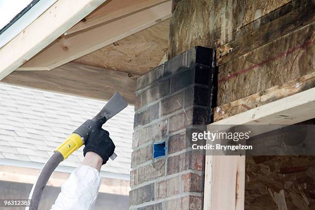 cleaning smoky bricks - damaged stock pictures, royalty-free photos & images