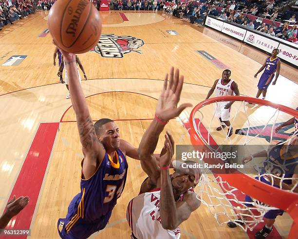 Diamon Simpson of the Los Angeles D-Fenders goes to the basket over Mickell Gladness of the Rio Grande Valley Vipers during the NBA D-League game on...