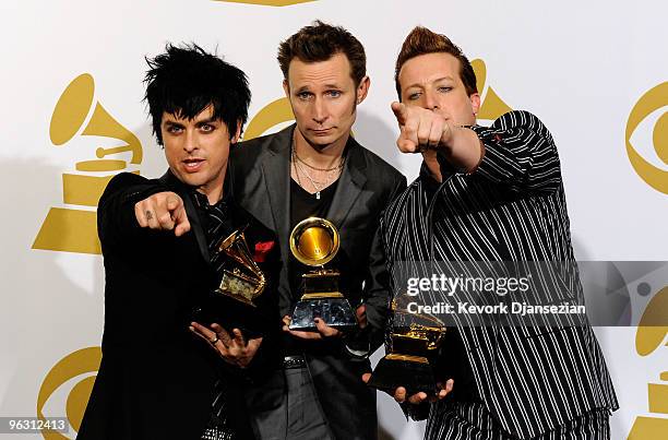 Musicians Billie Joe Armstrong, Mike Dirnt and Tre Cool of Green Day pose with Best Rock Album for '21st Century Breakdown' in the press room during...