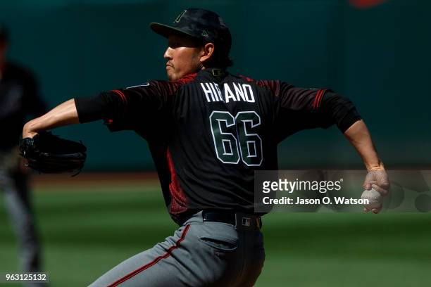 Yoshihisa Hirano of the Arizona Diamondbacks pitches against the Oakland Athletics during the eighth inning at the Oakland Coliseum on May 27, 2018...