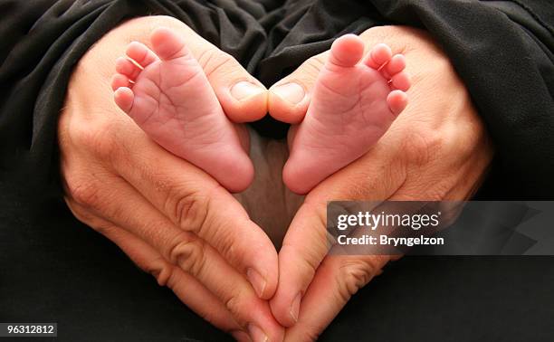 daddys hands - foot bone stock pictures, royalty-free photos & images