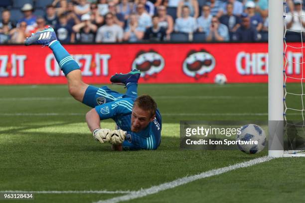 Penalty kick from Columbus Crew forward Gyasi Zerdes is deflected by Sporting Kansas City goalkeeper Tim Melia and off the post in the first half of...