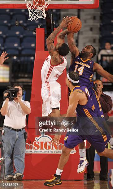 Joe Crawford of the Los Angeles D-Fenders blocks the shot of Julian Sensley of the Rio Grande Valley Vipers during the NBA D-League game on January...