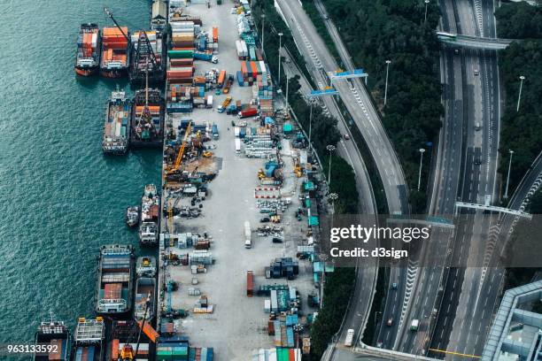 busy container cargo freight ship terminal in hong kong, china - consumerism china stock pictures, royalty-free photos & images