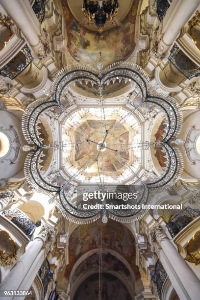 interior details of st. nicholas church in prague's old town square (stare mesto), czech republic - crystal chandelier stock pictures, royalty-free photos & images