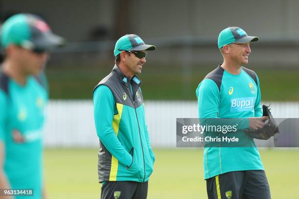 Coach Justin Langer land Brad Haddin talk during an Australian ODI training session at Allan Border Field on May 28, 2018 in Brisbane, Australia.