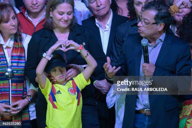 Colombian presidential candidate Gustavo Petro for the Colombia Humana Party addresses supporters in Bogota, next to his wife Veronica Alcocer and...