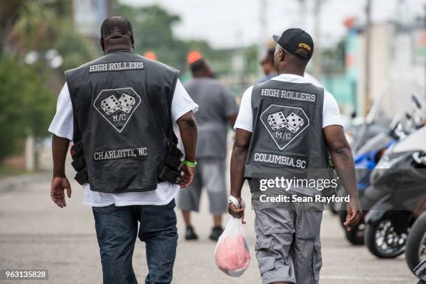 Two men walk down Atlantic St. On May 27, 2018 in Atlantic Beach, South Carolina. Also known as Atlantic Beach Bikefest and Black Bikers Week, the...