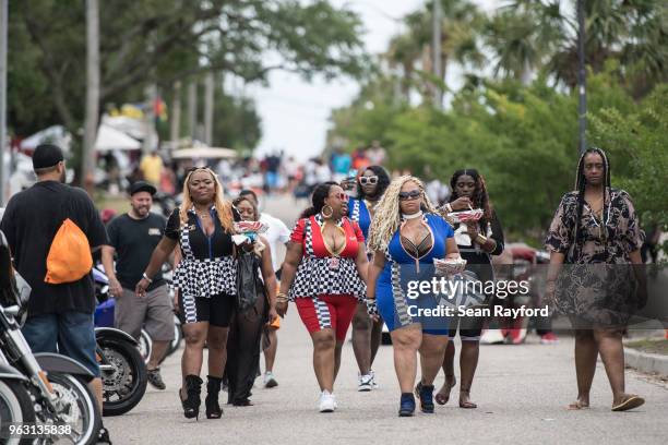 Nakosha "Cocoa" Smith, left, Keioka "Bombshell" Royal and Andrea "Hoodpriss" Shepherd, members of the New Orleans based Caramel Curves motorcycle...