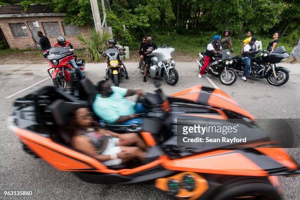 Motorcyclists watch as a vehicle drives by on Atlantic St. On May 27, 2018 in Atlantic Beach, South Carolina. Also known as Atlantic Beach Bikefest...