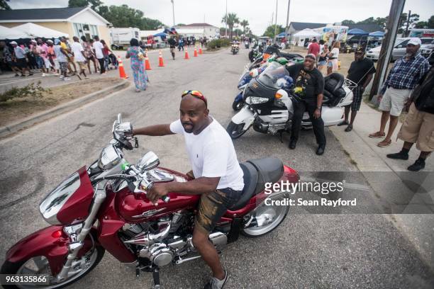 Motorcyclist pulls out onto Atlantic St. During Black Bike Week on May 27, 2018 in Atlantic Beach, South Carolina. Also known as Atlantic Beach...