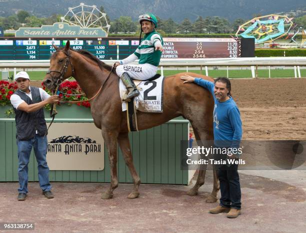 The Gold Cup race winner jockey Victor Espinoza on horse Accelerate takes a photo in the winners circle at Santa Anita race at Santa Anita Gold Cup...