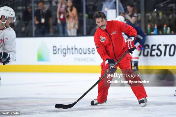 Capitals assistant coach Lane Lambert passes the puck during the Capitals practice for the NHL Stanley Cup Final Media Day on May 27, 2018 at...