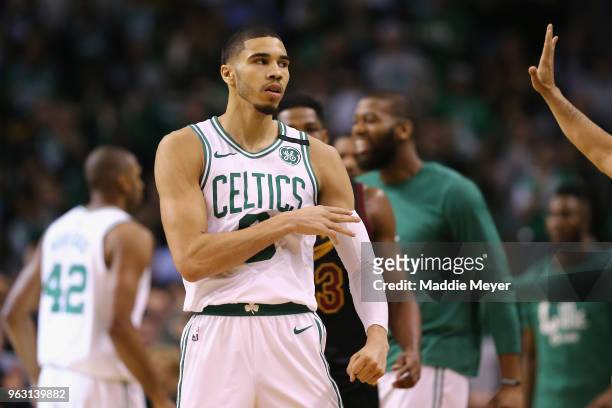 Jayson Tatum of the Boston Celtics reacts after making a basket in the first half against the Cleveland Cavaliers during Game Seven of the 2018 NBA...