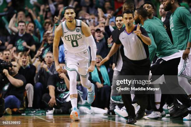 Jayson Tatum of the Boston Celtics reacts after making a basket in the first half against the Cleveland Cavaliers during Game Seven of the 2018 NBA...