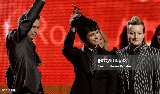 Musicians Mike Dirnt, Billie Joe Armstrong, and Tre Cool of Green Day accepts the Best Rock Album award onstage during the 52nd Annual GRAMMY Awards...