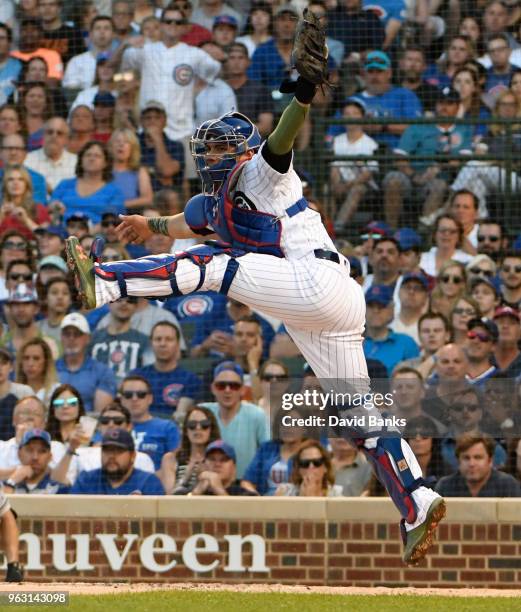 Willson Contreras of the Chicago Cubs takes a late throw home against the San Francisco Giants during the first inning on May 27, 2018 at Wrigley...