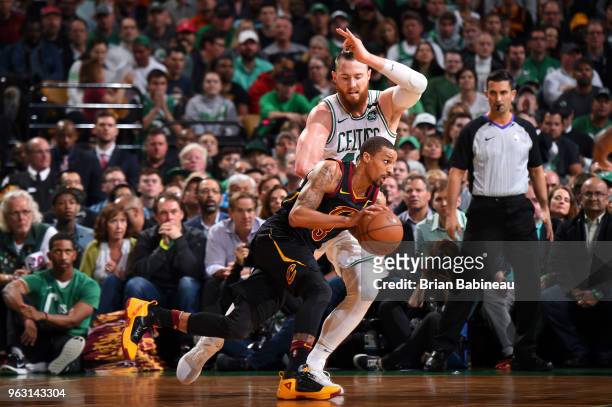 George Hill of the Cleveland Cavaliers drives against Aron Baynes of the Boston Celtics during Game Seven of the Eastern Conference Finals of the...