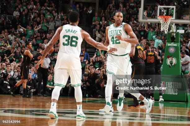 Marcus Smart and Al Horford of the Boston Celtics high five during the game against the Cleveland Cavaliers during Game Seven of the Eastern...