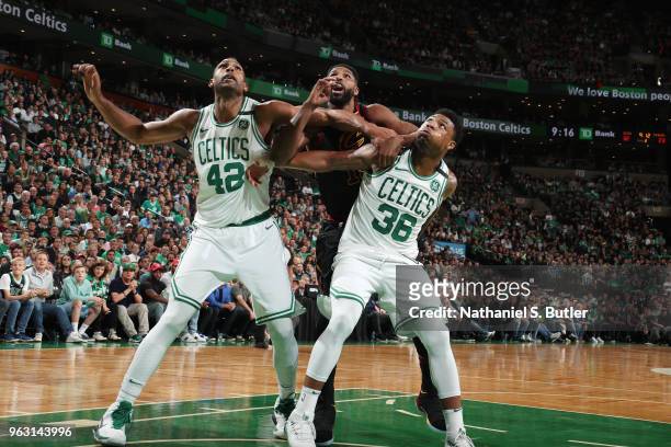 Tristan Thompson of the Cleveland Cavaliers battles for position against Al Horford and Marcus Smart of the Boston Celtics during Game Seven of the...