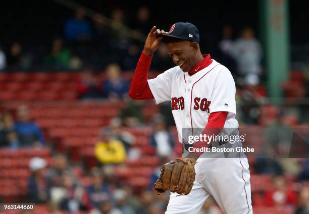 Former Boston Red Sox player Dennis "Oil Can" Boyd reacts as he steps off of the mound during the first inning of the Red Sox alumni game at Fenway...